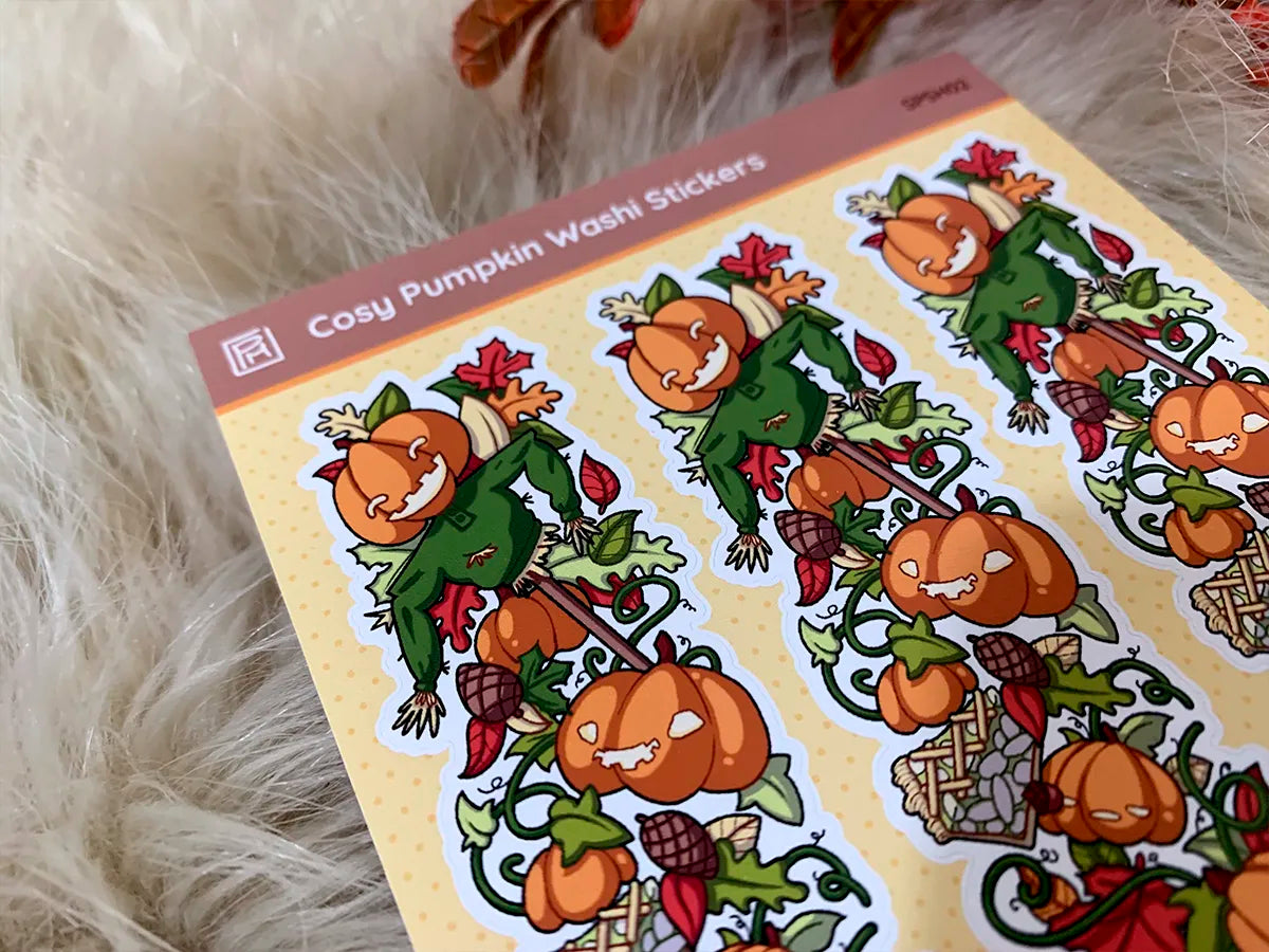 Close up of a cosy washi tape sticker featuring a fall scarecrow